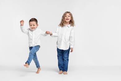 Photo of Cute little children on white background. Space for text