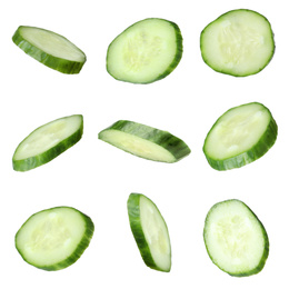 Image of Set of fresh cucumber slices on white background