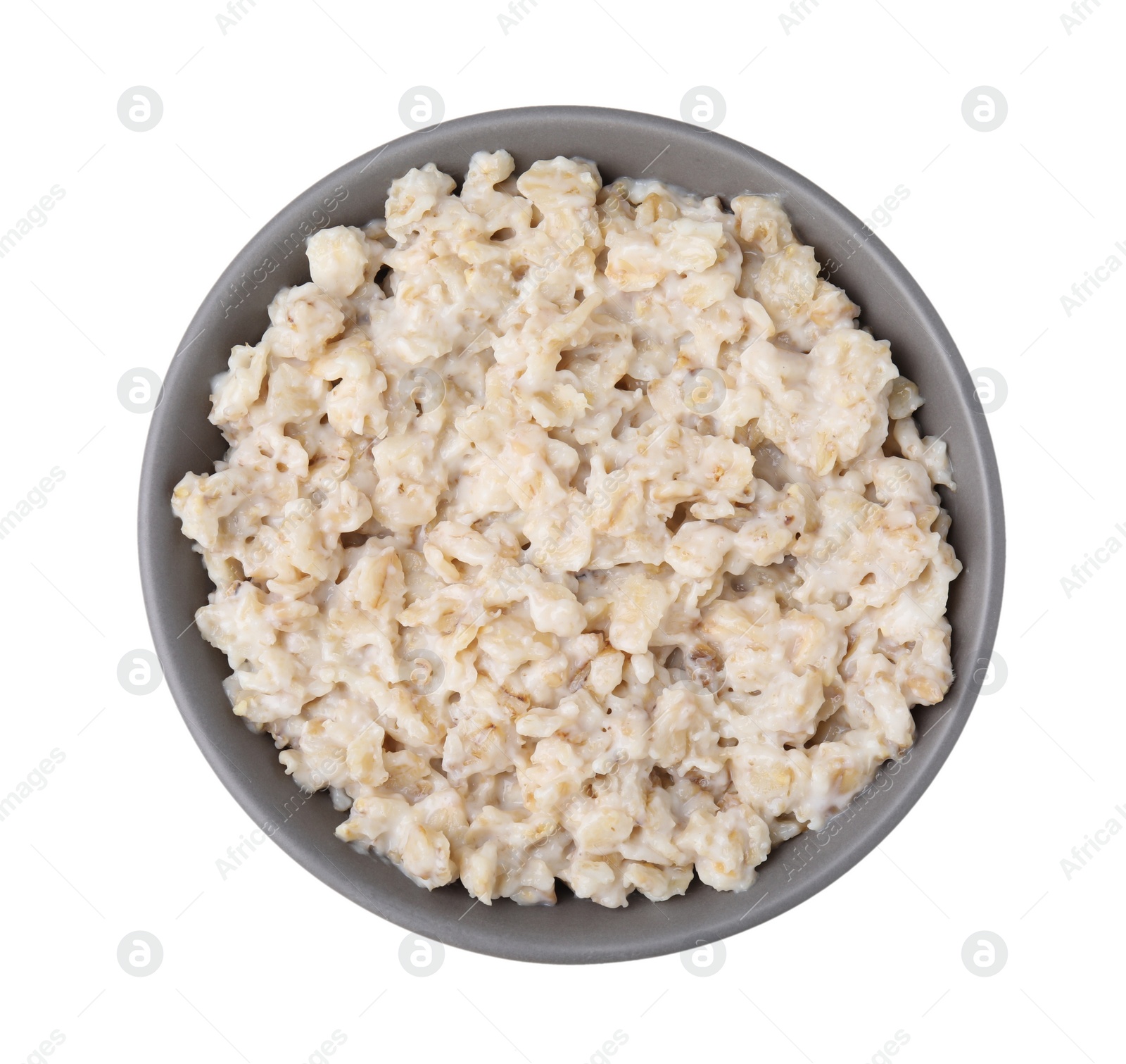 Photo of Ceramic bowl with oatmeal isolated on white, top view