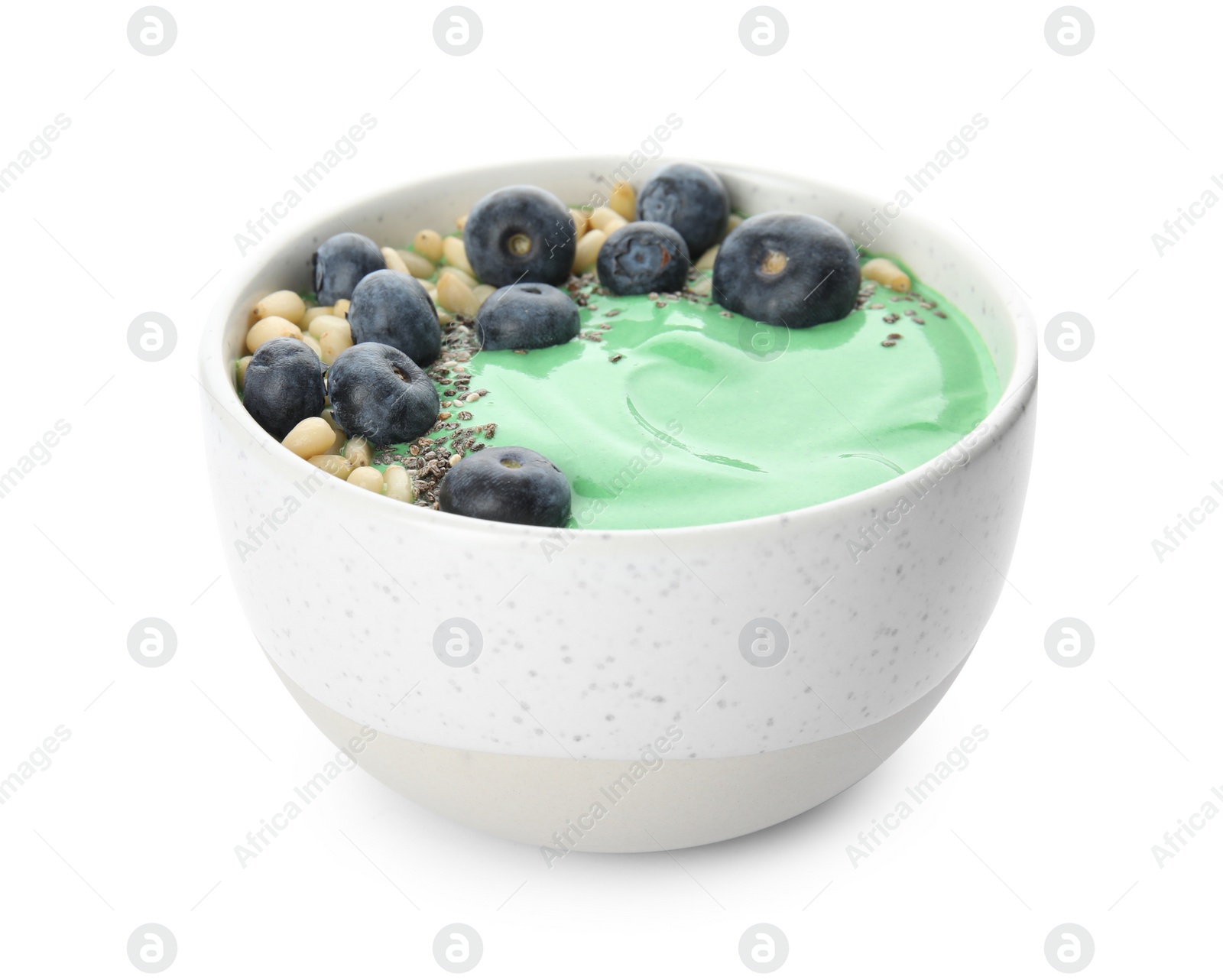 Photo of Bowl of spirulina smoothie isolated on white