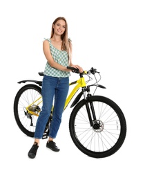 Happy young woman with bicycle on white background