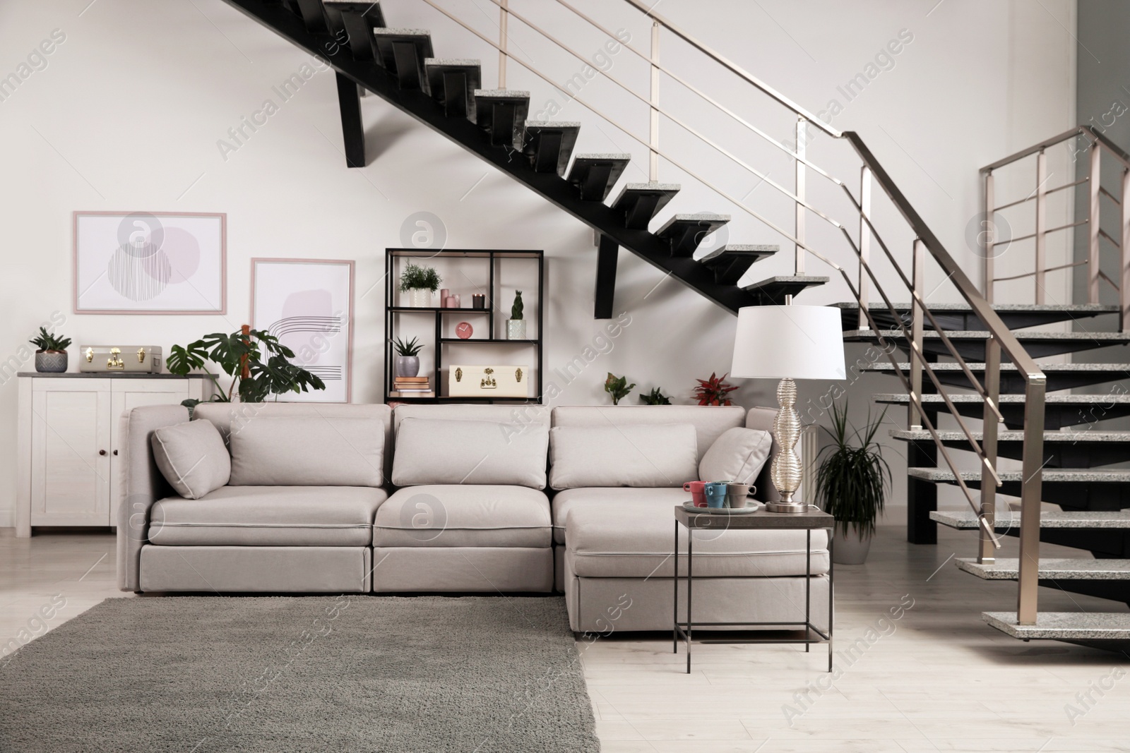 Photo of Stylish living room interior with comfortable sofa