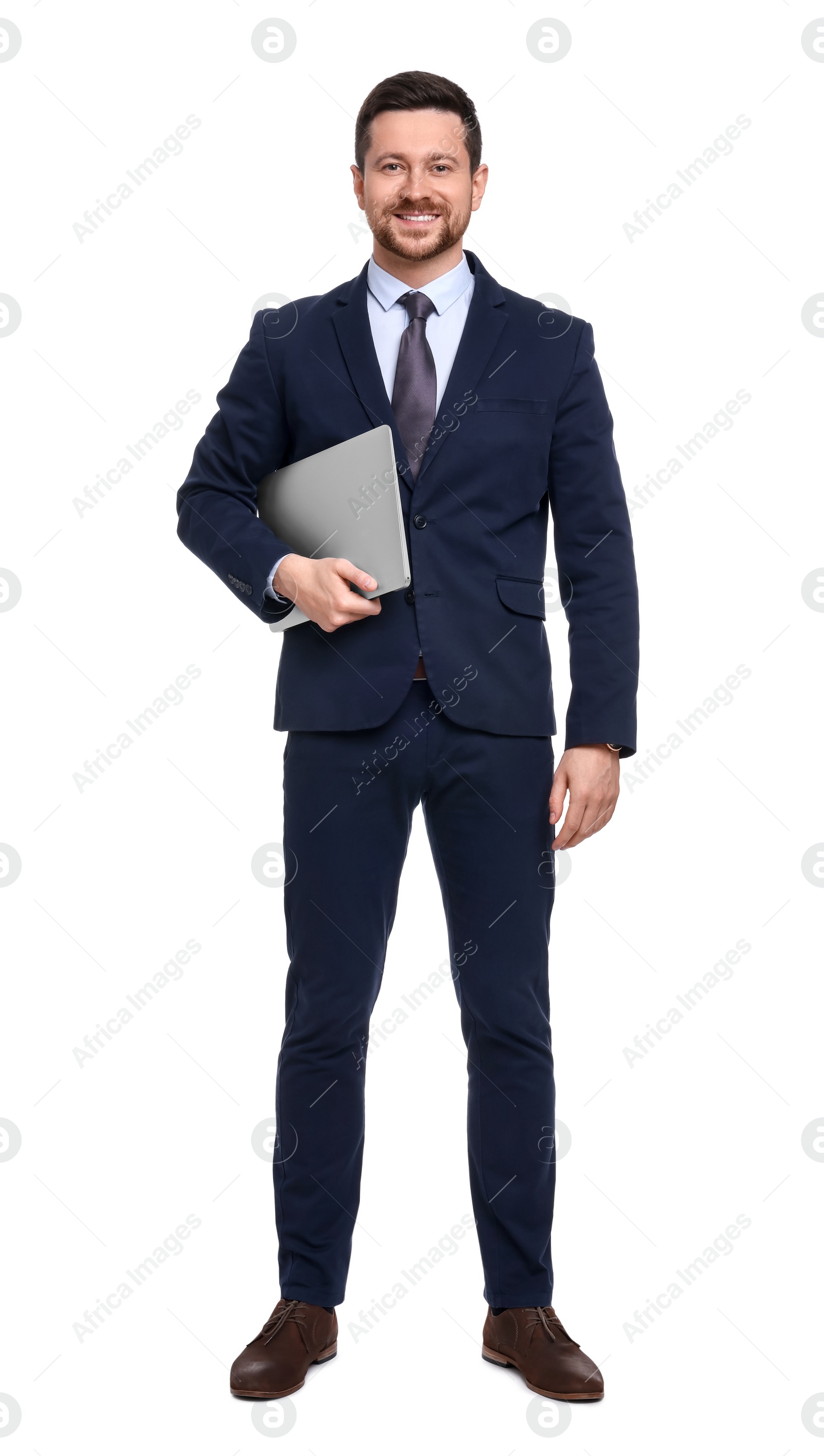 Photo of Handsome bearded businessman in suit with laptop on white background