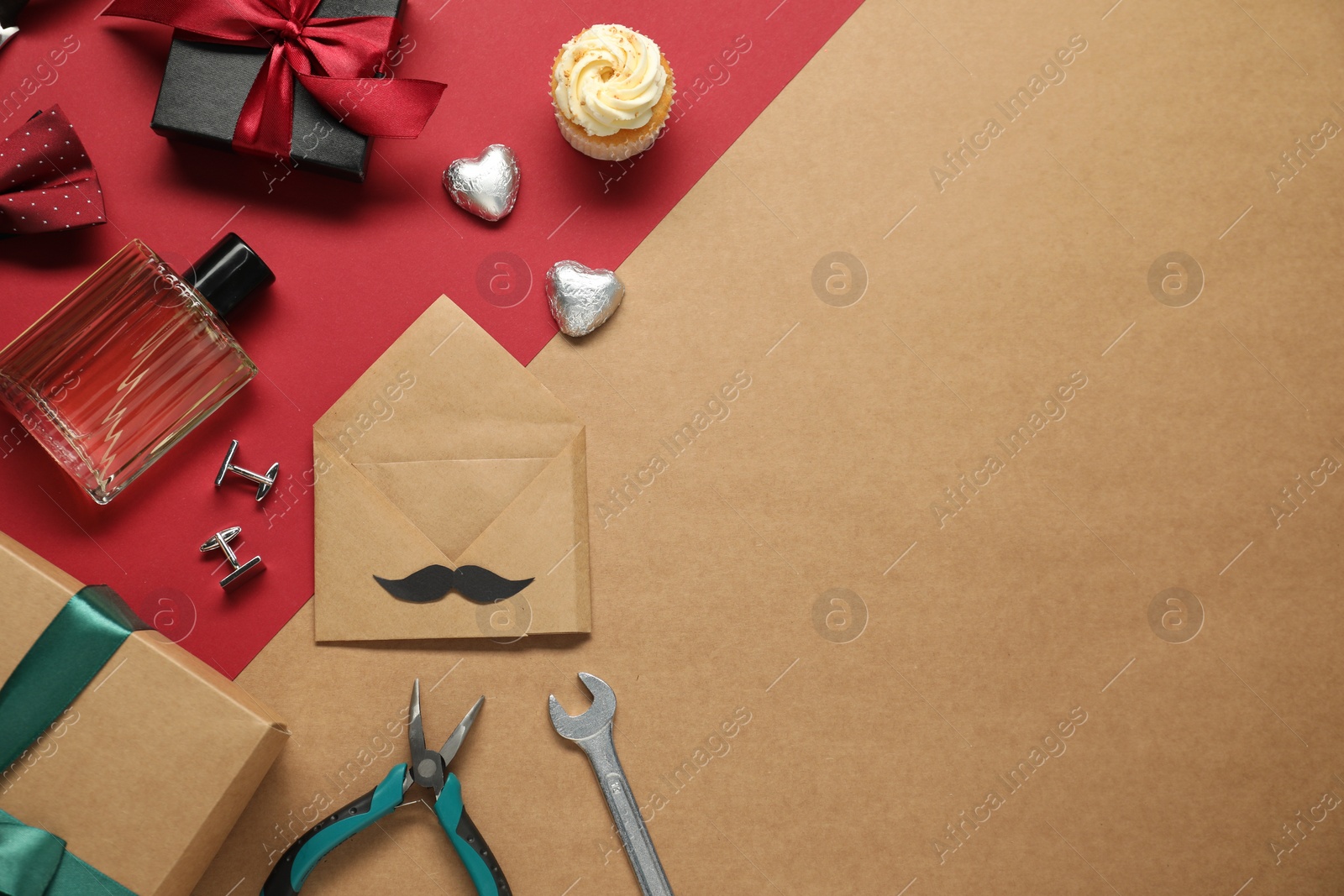 Photo of Father's day celebration. Gift box, sweets and men accessories on color background, flat lay. Space for text