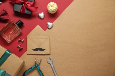 Photo of Father's day celebration. Gift box, sweets and men accessories on color background, flat lay. Space for text