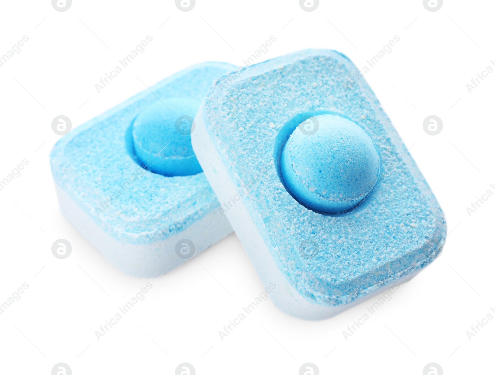 Photo of Two water softener tablets isolated on white