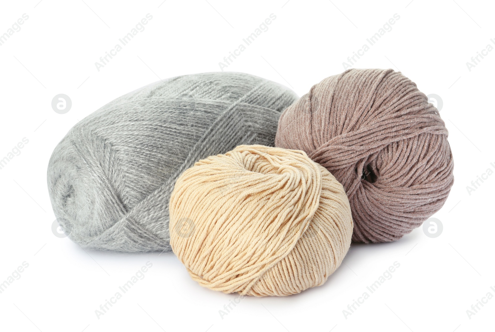 Photo of Different balls of woolen knitting yarns on white background