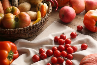 Photo of Different fresh ripe vegetables, berries and fruits on wooden table. Farmer produce