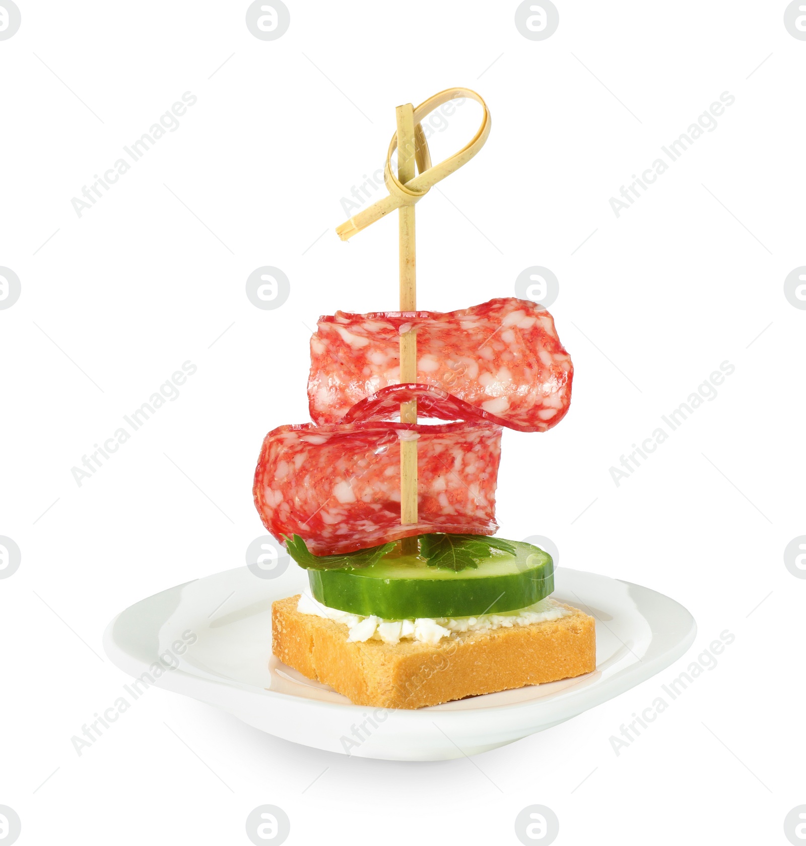 Photo of Tasty canape with salami, cucumber and cream cheese isolated on white