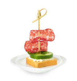 Photo of Tasty canape with salami, cucumber and cream cheese isolated on white