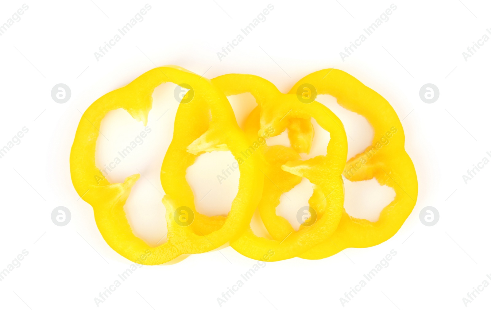 Photo of Rings of yellow bell pepper isolated on white, top view