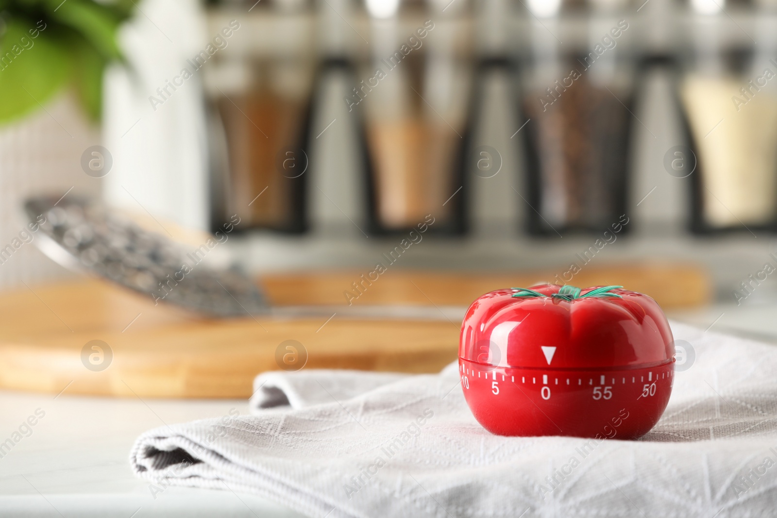 Photo of Kitchen timer in shape of tomato on white table. Space for text