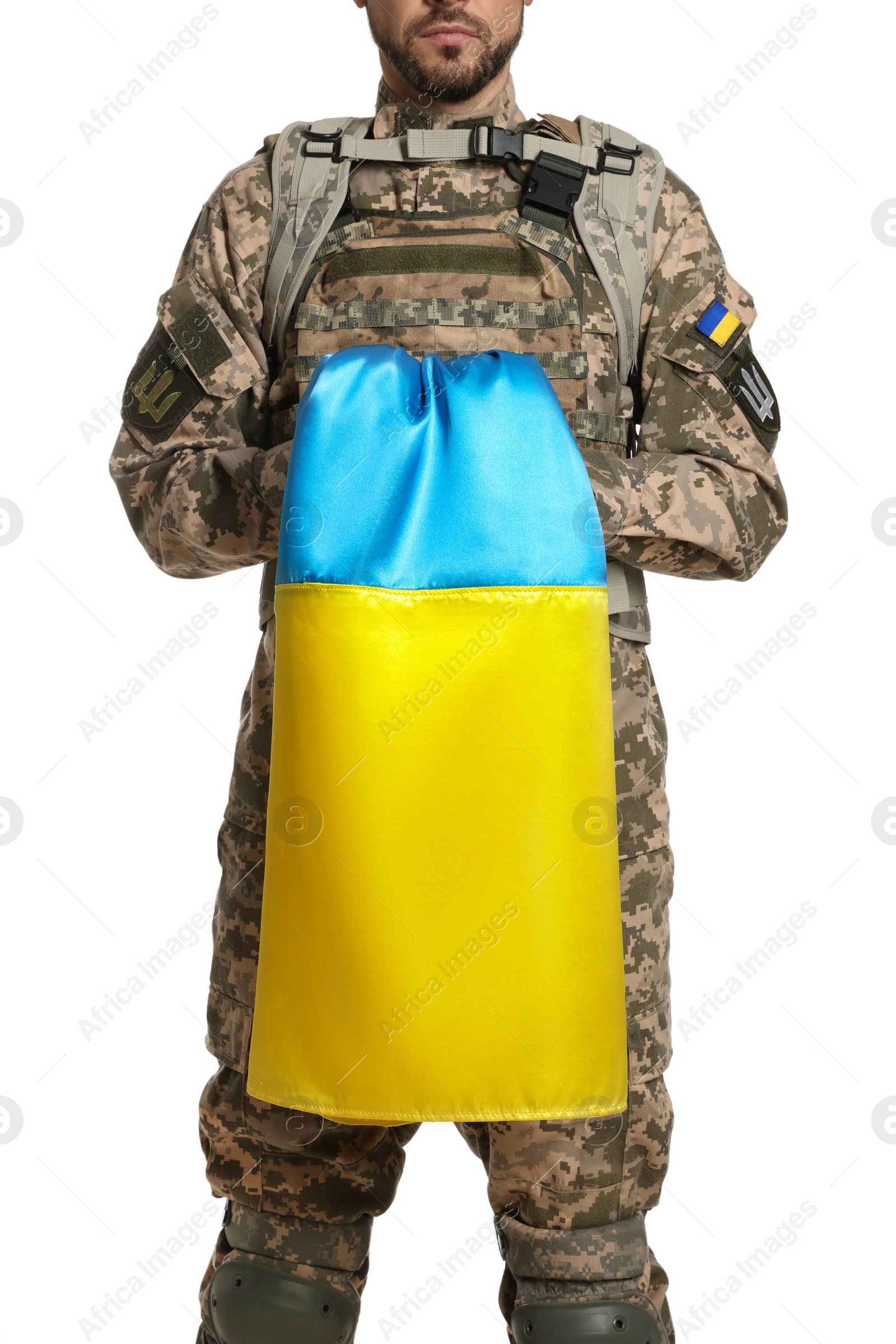 Photo of Soldier in military uniform with Ukrainian flag on white background, closeup