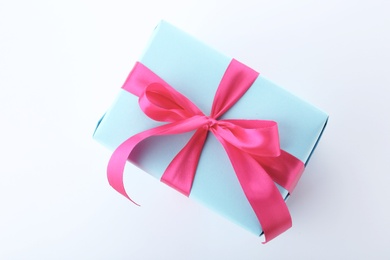 Photo of Beautiful gift box with ribbon on white background