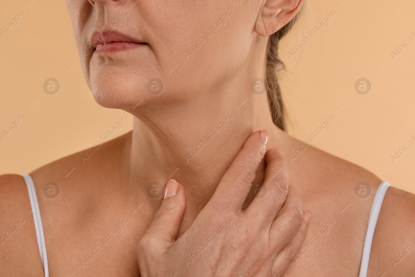 Photo of Woman with normal skin on beige background, macro view