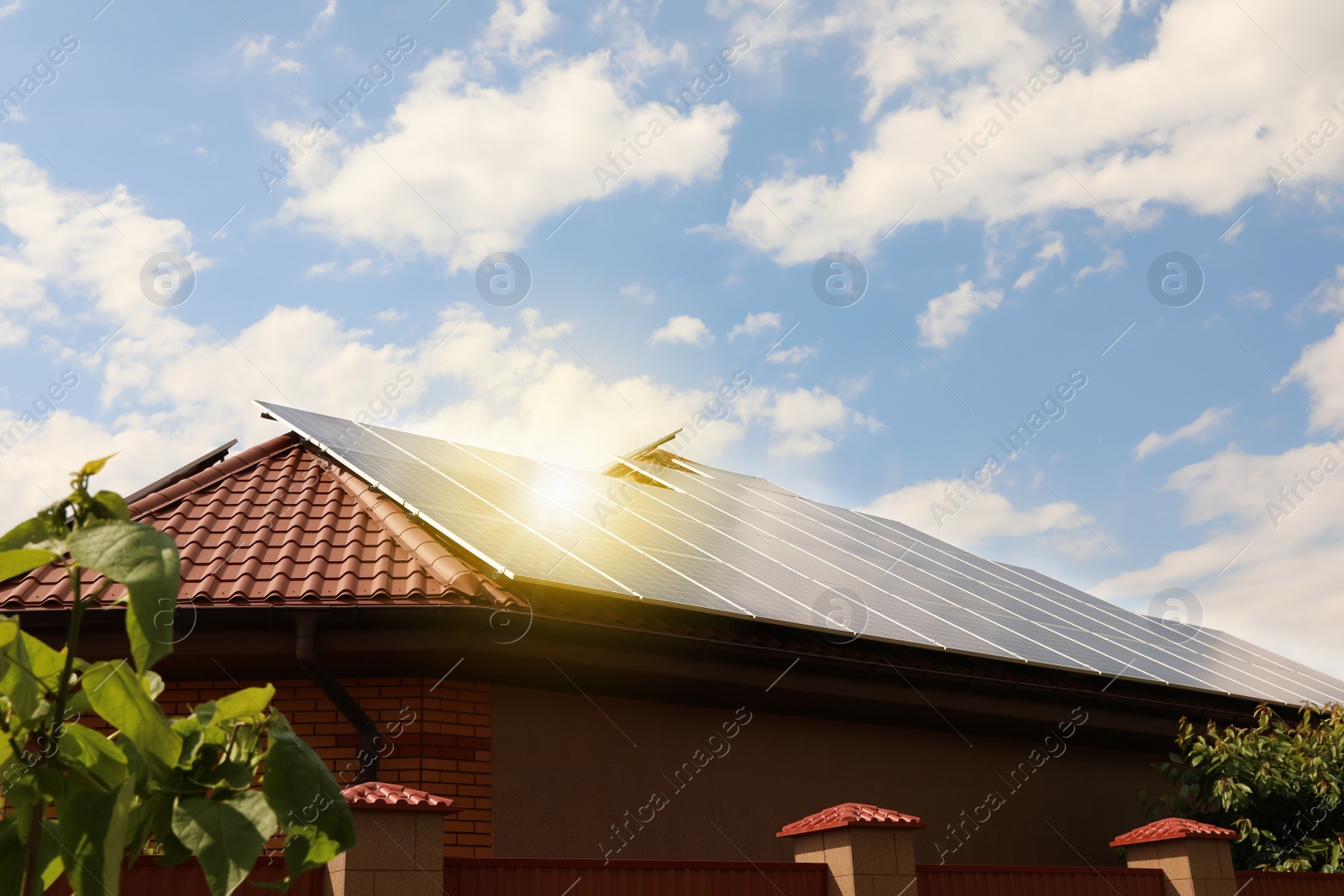 Photo of Building with installed solar panels on roof. Alternative energy source