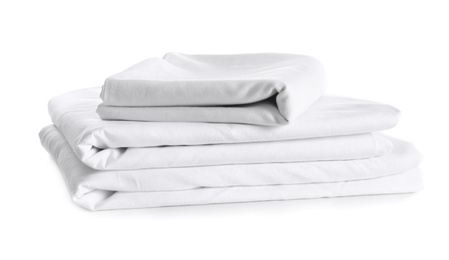 Photo of Stack of clean bed linen isolated on white