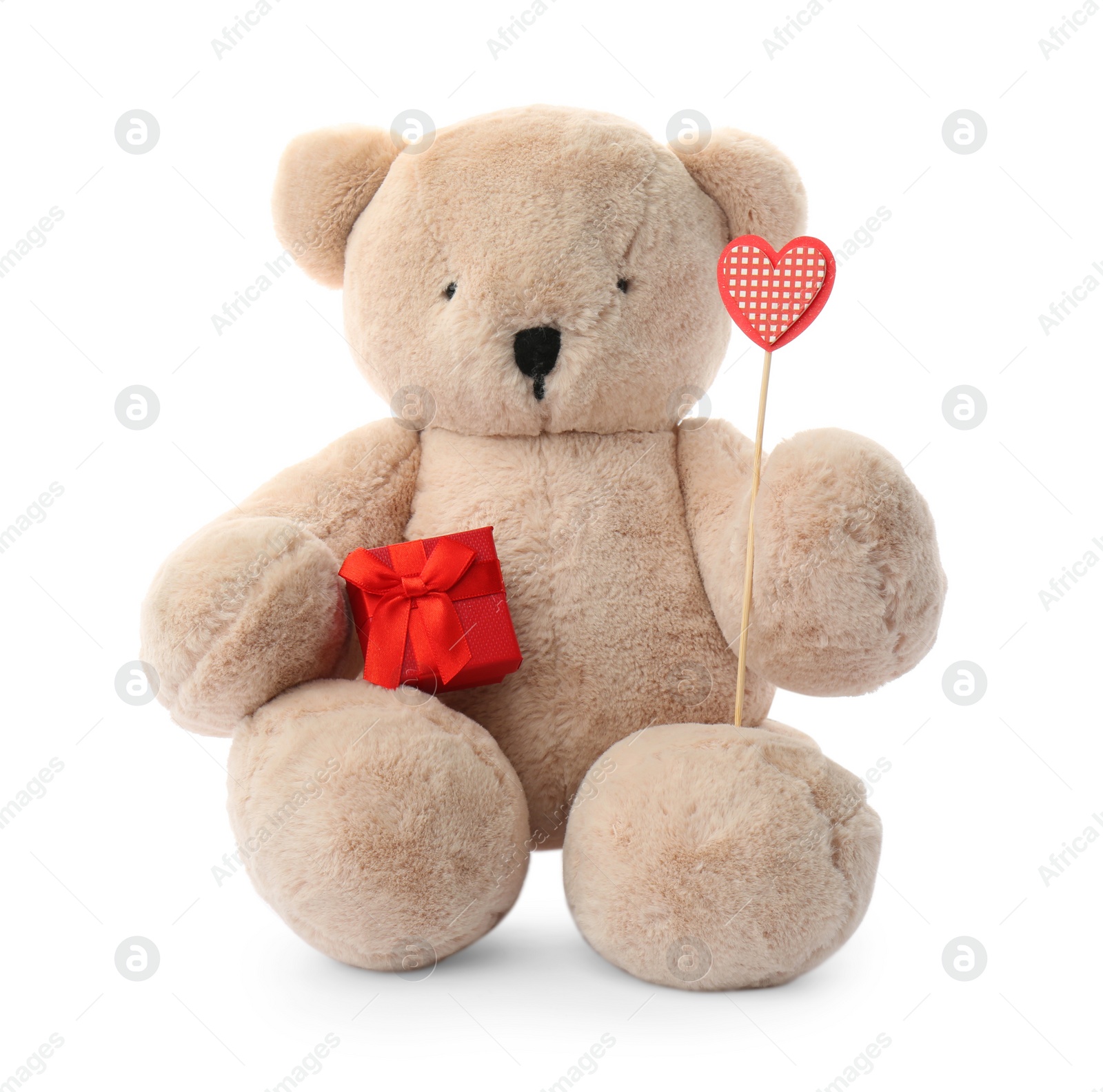 Photo of Cute teddy bear with red heart and gift box on white background. Valentine's day celebration