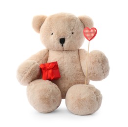 Cute teddy bear with red heart and gift box on white background. Valentine's day celebration