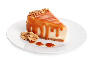 Photo of Piece of delicious cake with caramel and walnuts isolated on white
