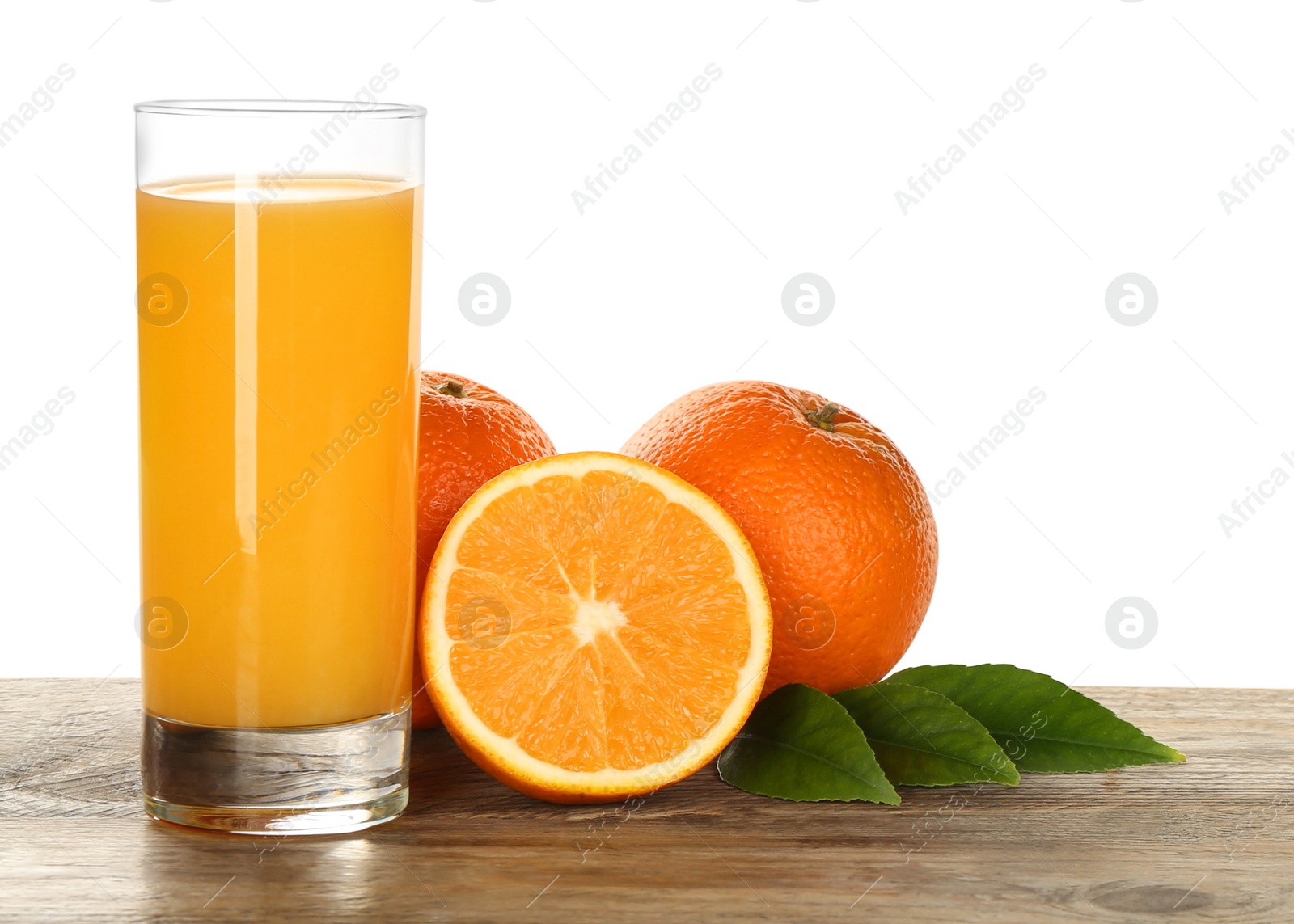 Photo of Delicious orange juice and fresh fruits on wooden table against white background. Space for text