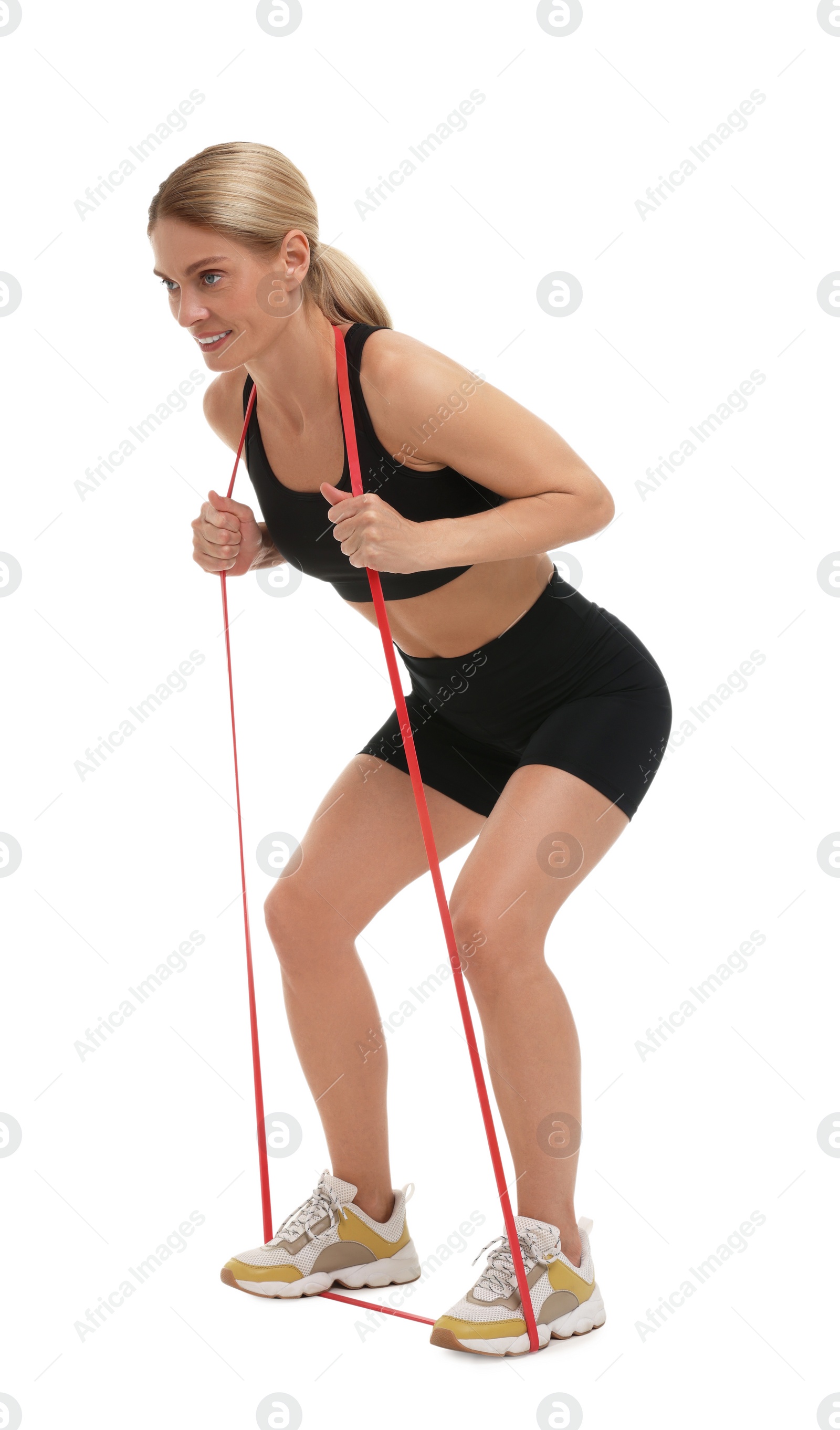 Photo of Woman exercising with elastic resistance band on white background