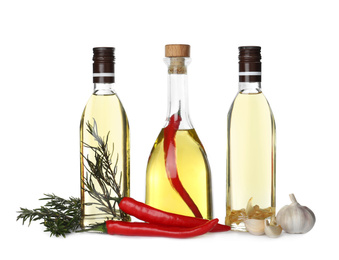 Photo of Different sorts of cooking oil and ingredients isolated on white