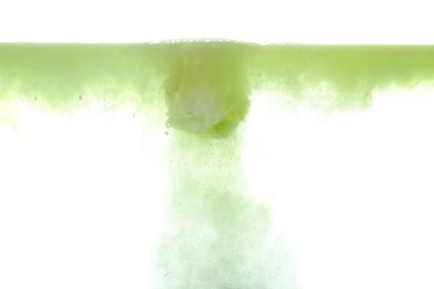 Photo of Bath bomb in water on white background