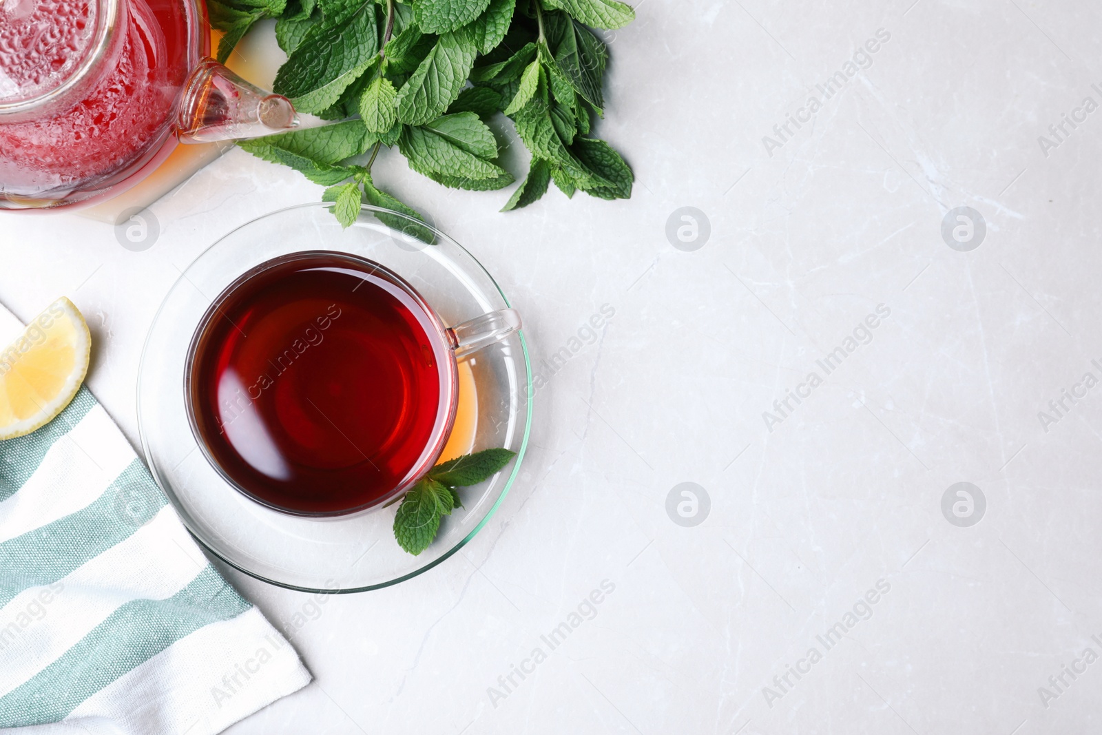 Photo of Fresh tea with mint on light table, flat lay. Space for text