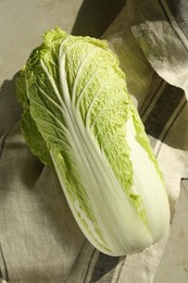 Photo of Fresh ripe Chinese cabbage on gray table, top view