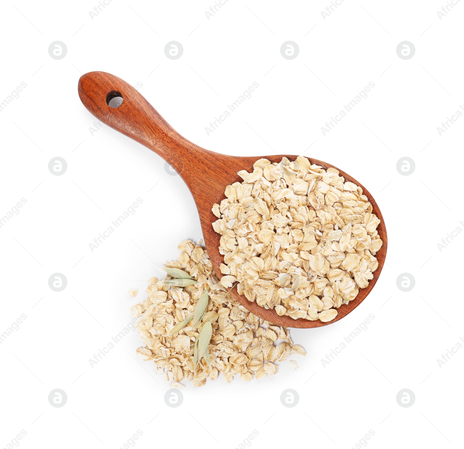 Photo of Wooden spoon with oatmeal and florets isolated on white, top view