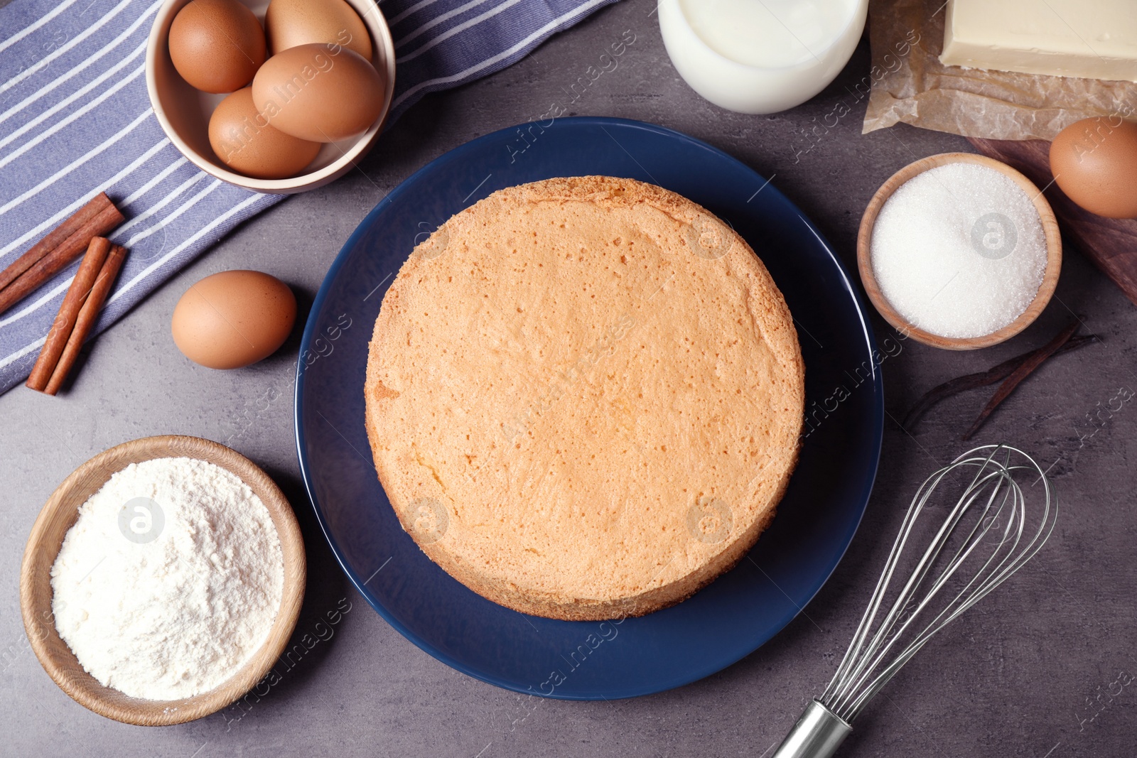 Photo of Flat lay composition with delicious fresh homemade cake on grey marble table