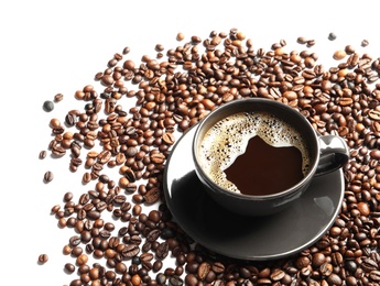 Photo of Roasted coffee beans and cup of hot beverage on white background