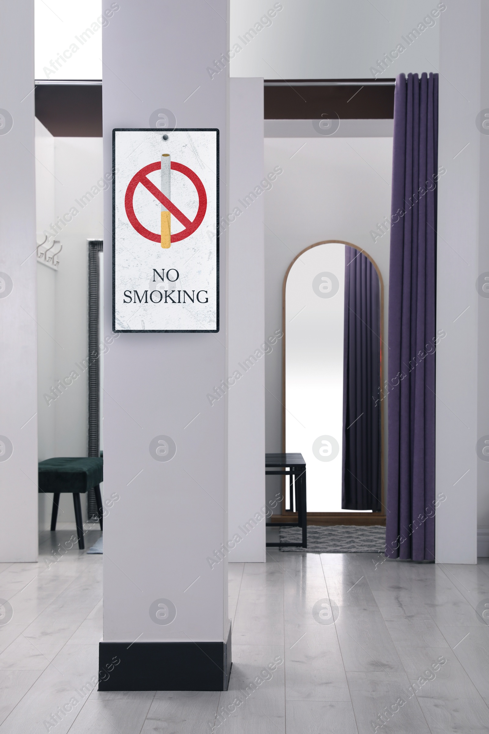 Image of Sign No Smoking near dressing room in fashion store