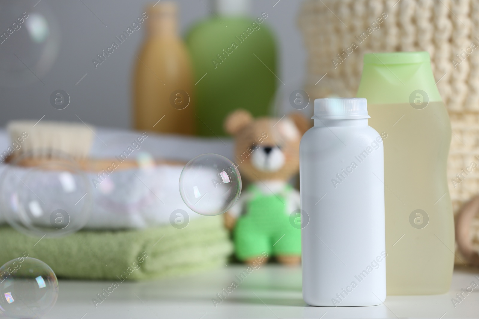 Photo of Baby cosmetic products on white table, space for text