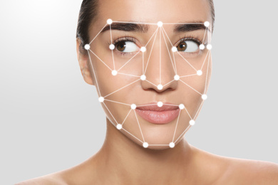 Image of Facial recognition system. Woman with digital biometric grid on light background, closeup