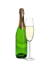 Photo of Bottle and glass with champagne on white background. Festive drink