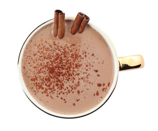 Delicious cocoa drink with cinnamon sticks on white background, top view