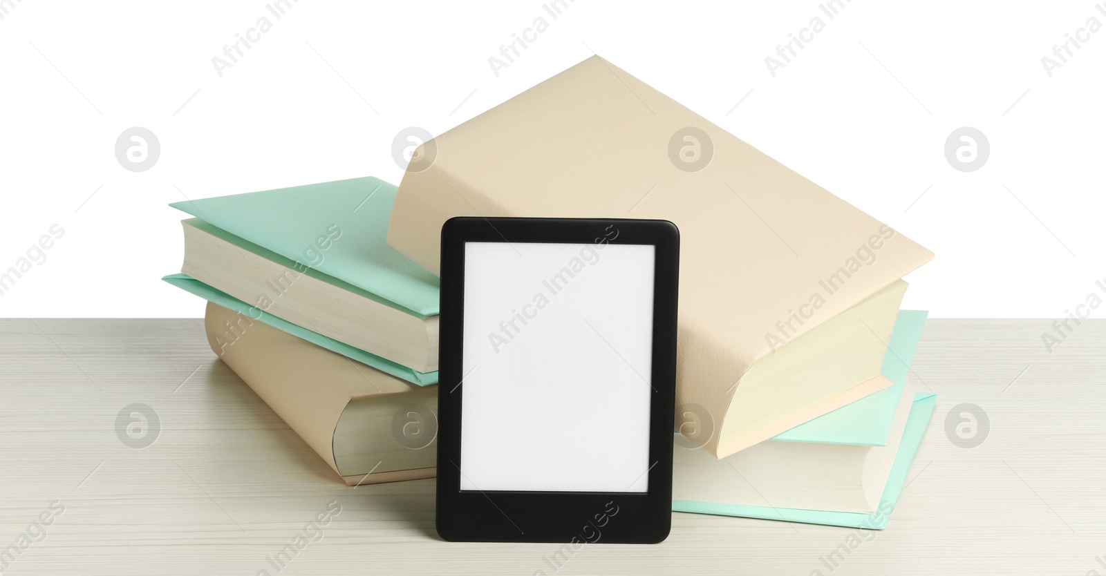Photo of Hardcover books and modern e-book on wooden table against white background