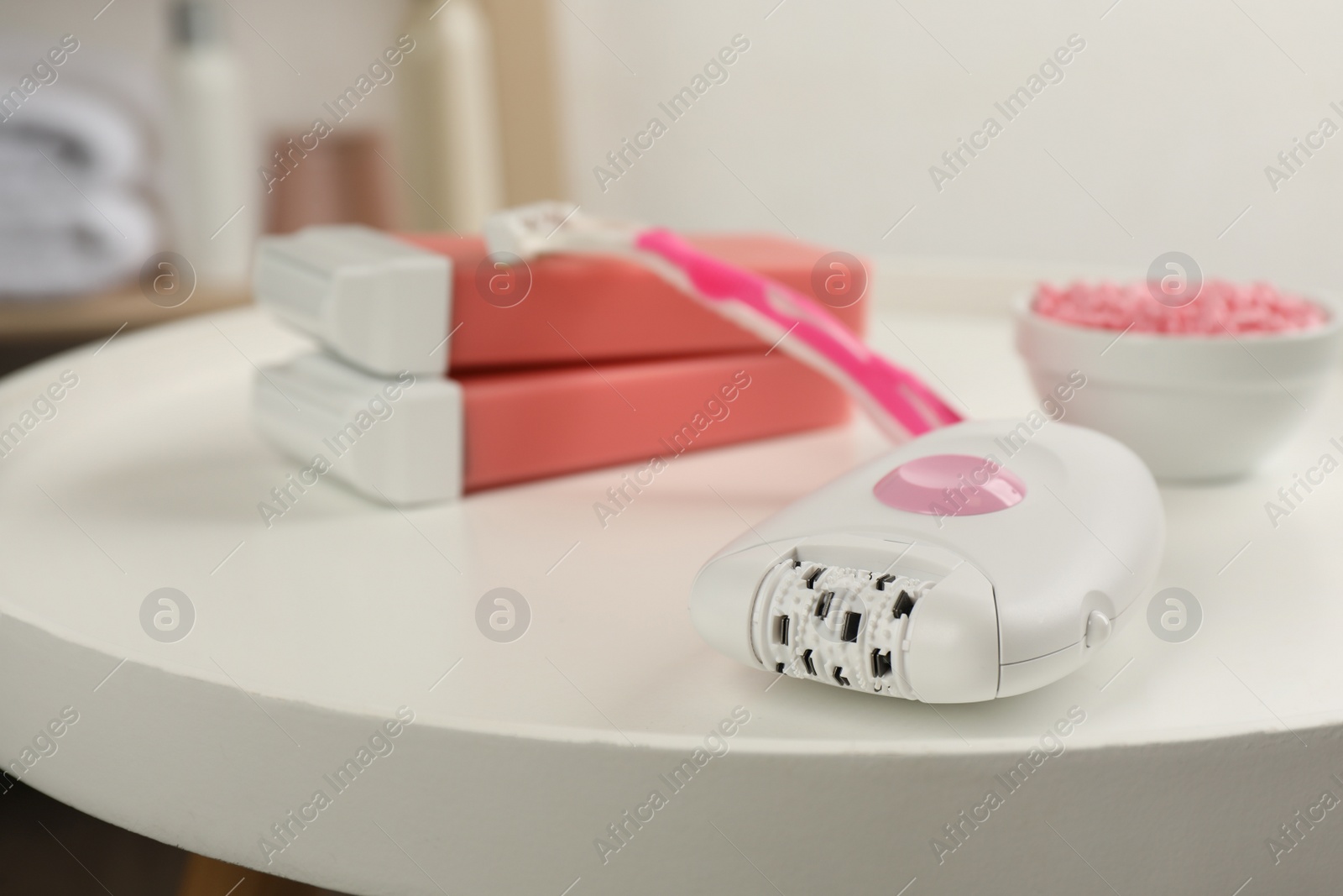 Photo of Set of epilation products on white table indoors