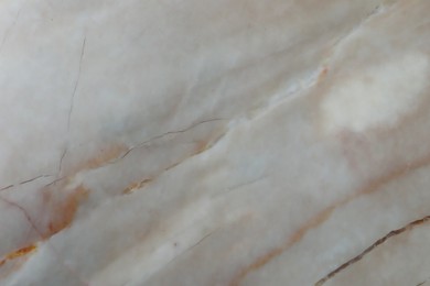Texture of beige marble surface as background, closeup