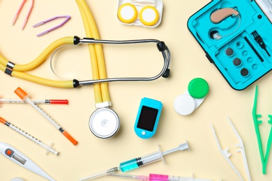 Flat lay composition with medical objects on color background