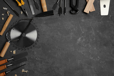 Photo of Flat lay composition with carpenter's tools on grey background. Space for text