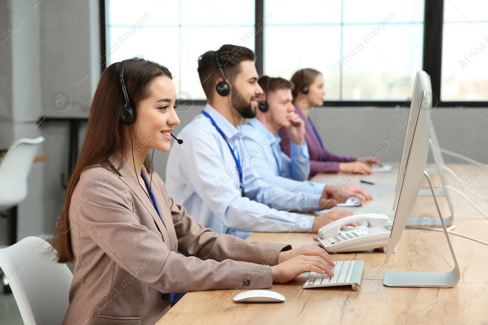 Photo of Technical support operators working in modern office