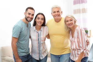 Photo of Portrait of happy family at home. Reunion of generations