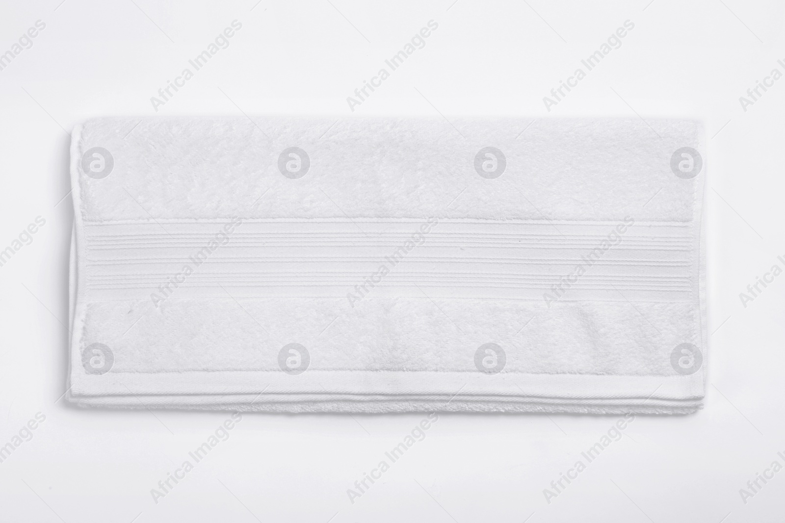 Photo of Clean soft towel on white background