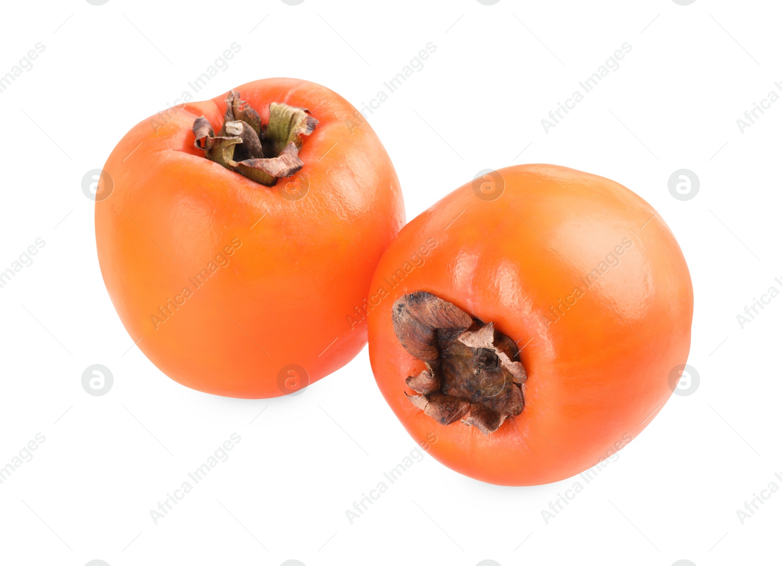 Photo of Delicious ripe juicy persimmons isolated on white