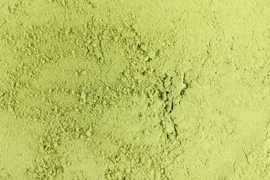 Photo of Green matcha powder as background, top view