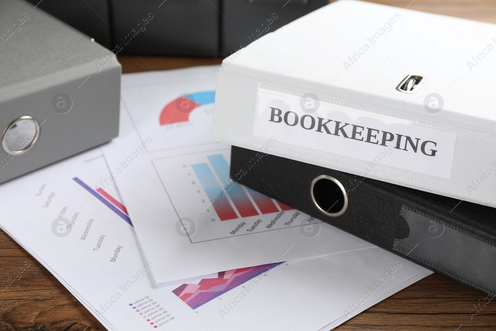 Photo of Folders and documents on desk in office, closeup. Bookkeeper's workplace