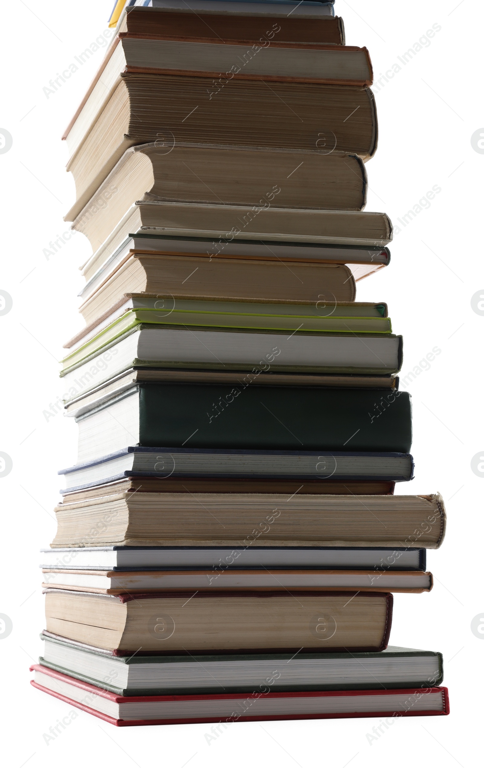 Photo of High stack of many different books isolated on white